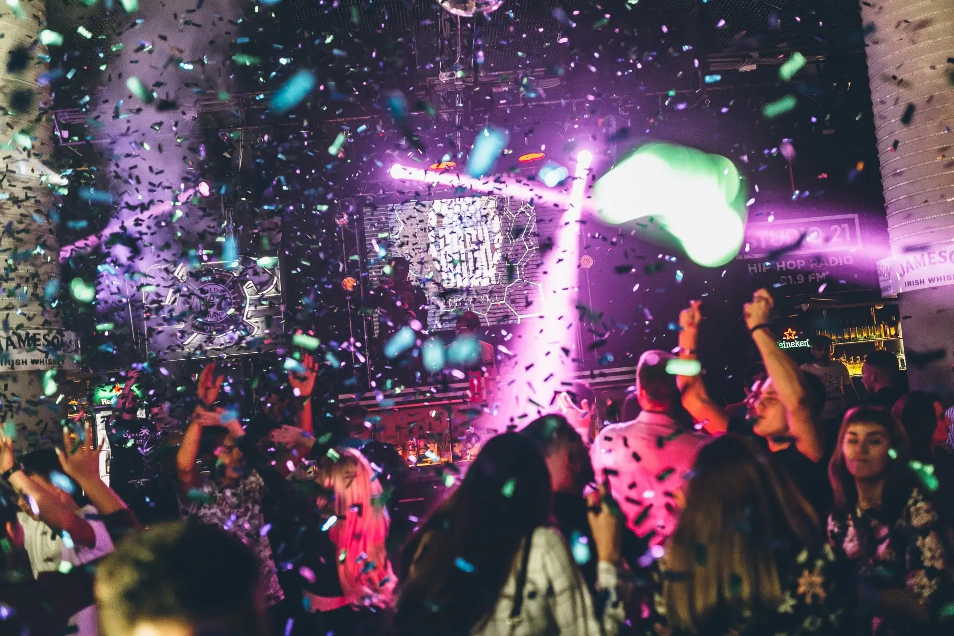 Party scene with lots of confetti, DJ on stage